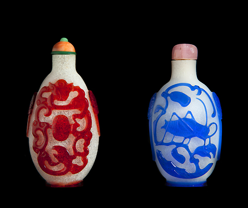 Elongated flattened ovoid-shaped snuff bottle with chilong and shou character, and bottle with cricket