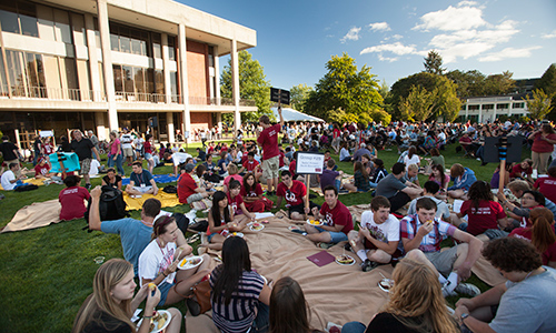 Students from the class of 2016 bask in the sun during an Opening Days picnic. 