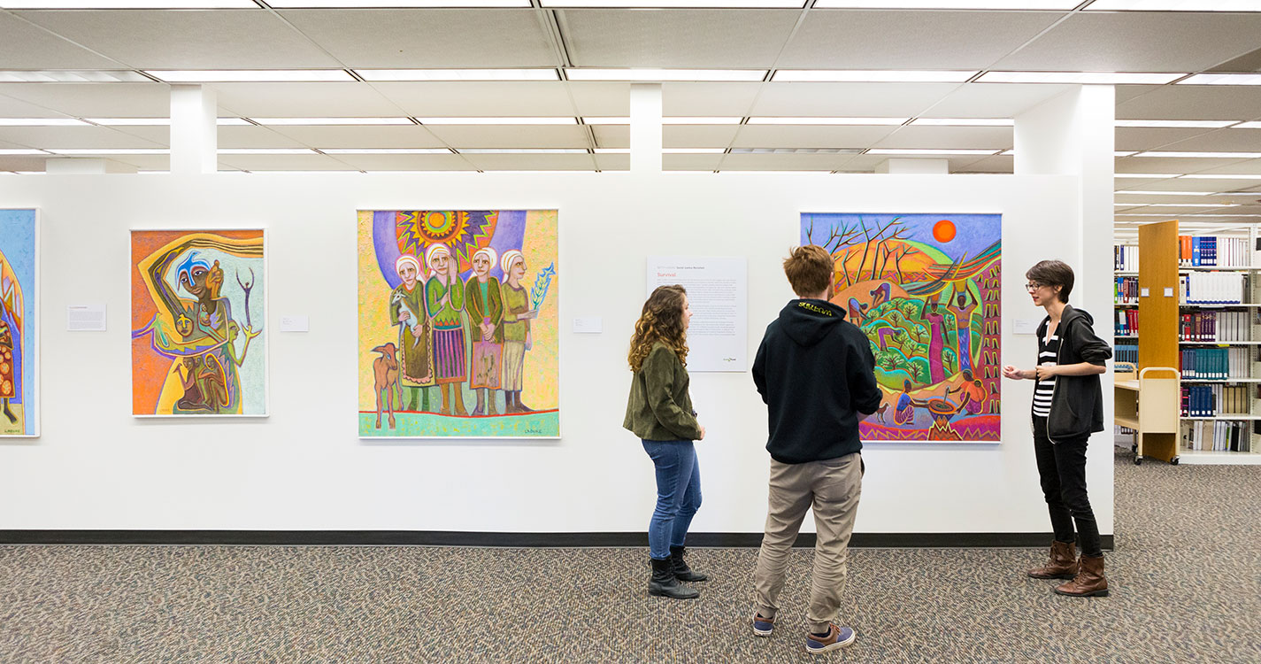 Students viewing Betty LaDuke painting