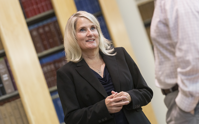 Tamara Palmer stands in the law library